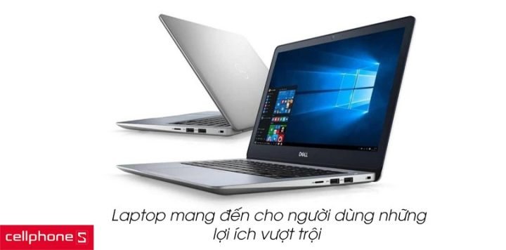 Một người phụ nữ đang sử dụng laptop trên bàn làm việc, thể hiện sự tiện lợi của máy tính xách tay trong công việc hàng ngày.