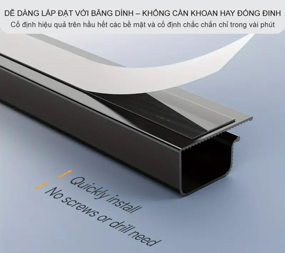 Dụng cụ quản lý cáp chữ J đang được dán vào mặt dưới bàn làm việc bằng băng dính chuyên dụng